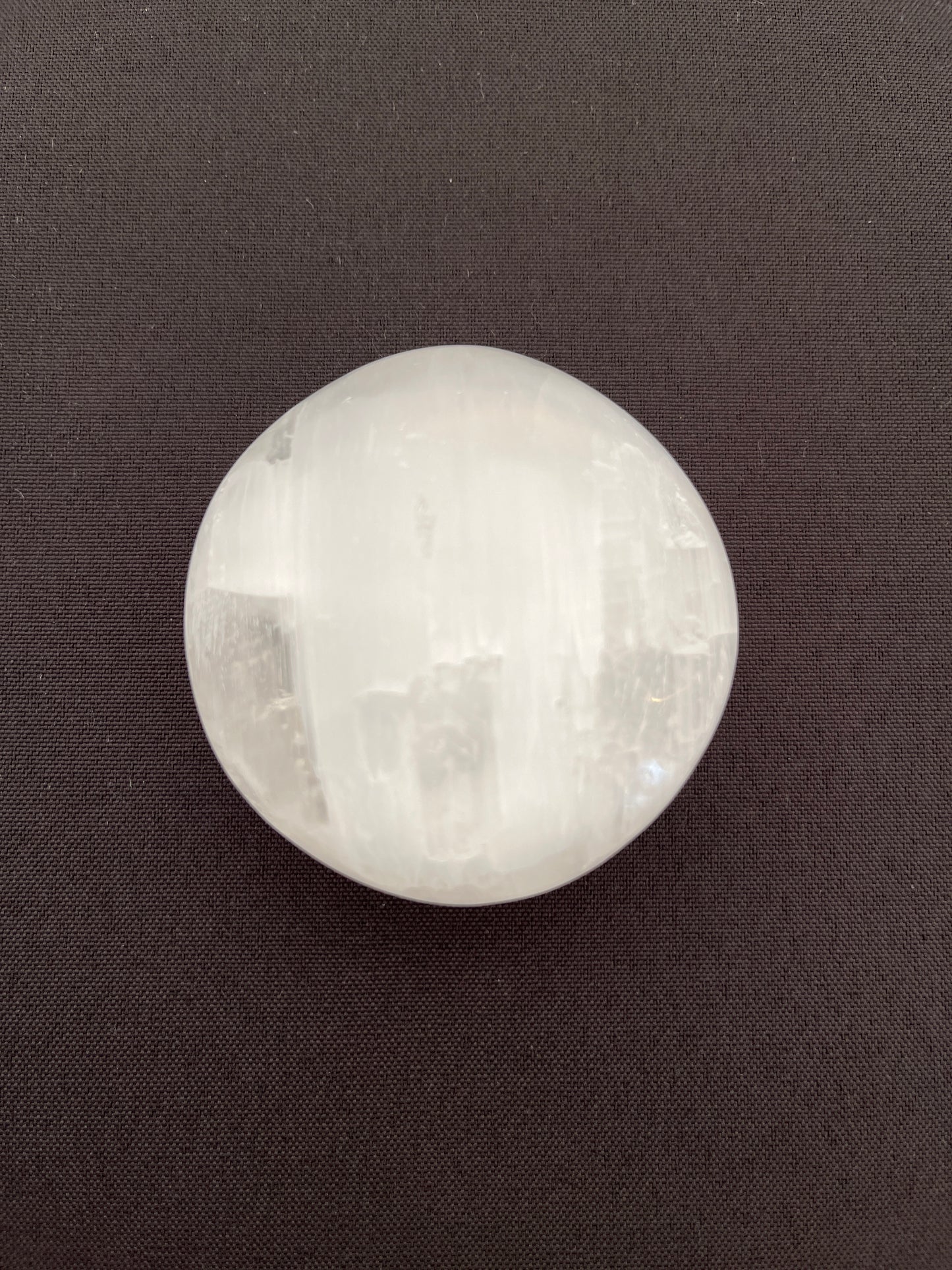 Selenite Puffy Palm Stone EC25003