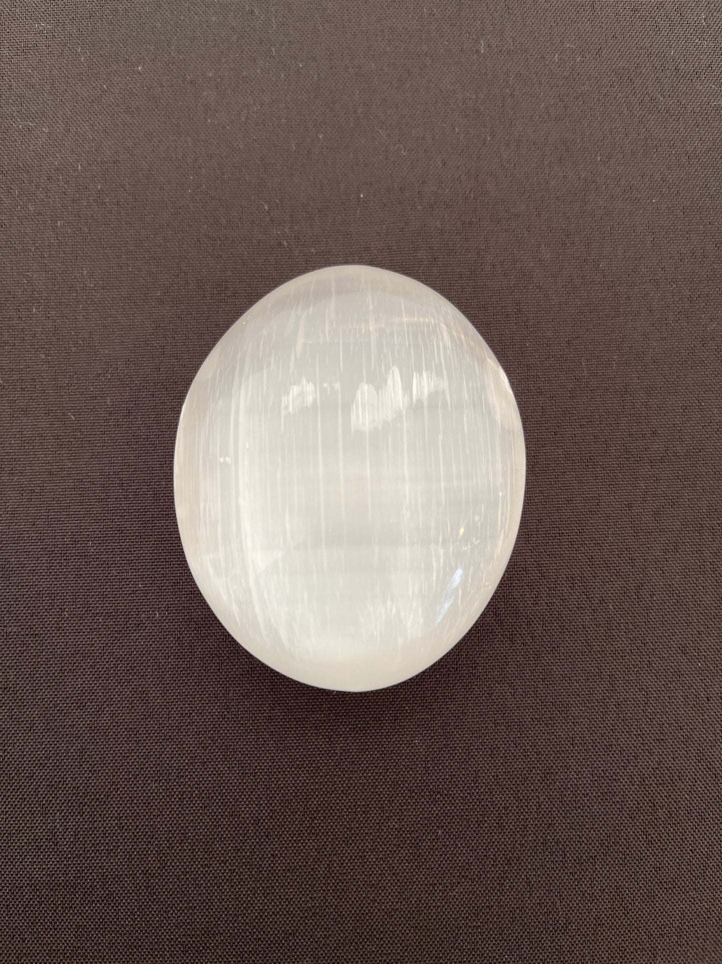 Selenite Puffy Palm Stone EC25001